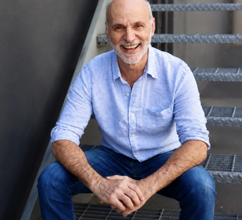 Portrait of Dave Cesana sitting on stairs